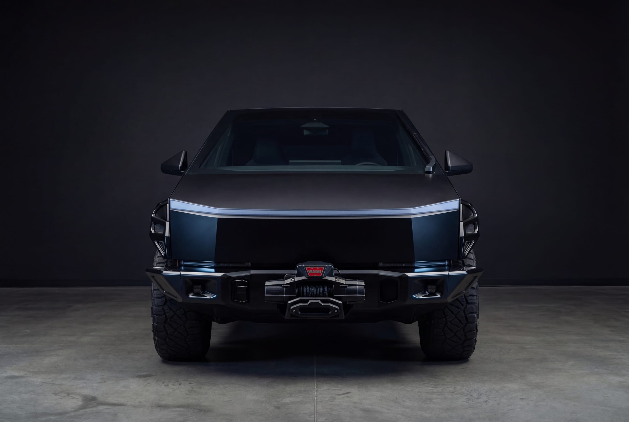 Front view of a Cybertruck fitted with the Xolaris winch bumper (render)