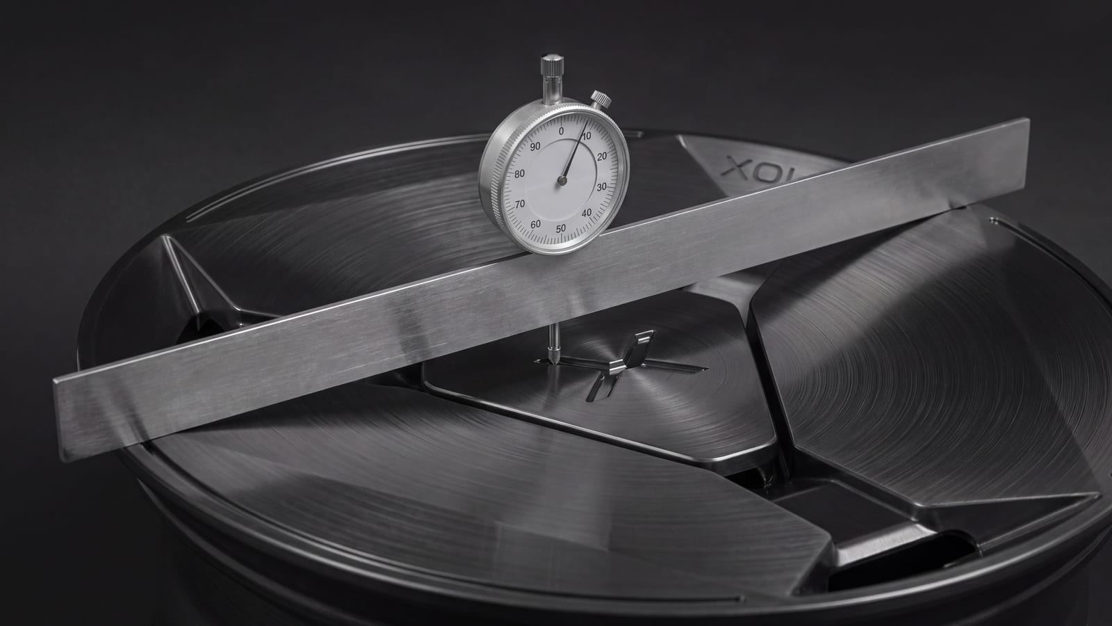 Dial gauge on a straightedge across the face of a forged wheel, measuring backspacing (render)
